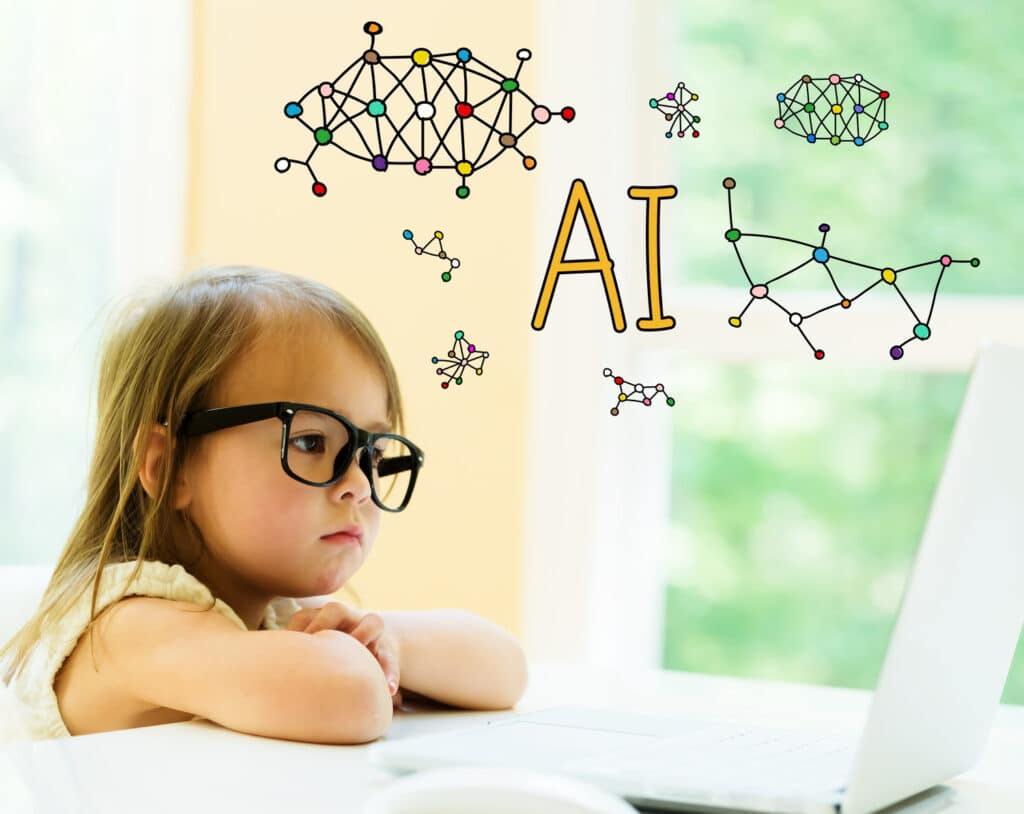toddler looking at laptop with AI in yellow letters