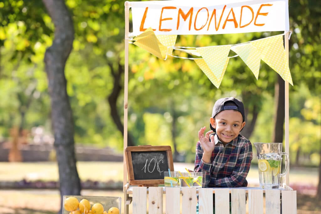 little boy at lemonade stand
