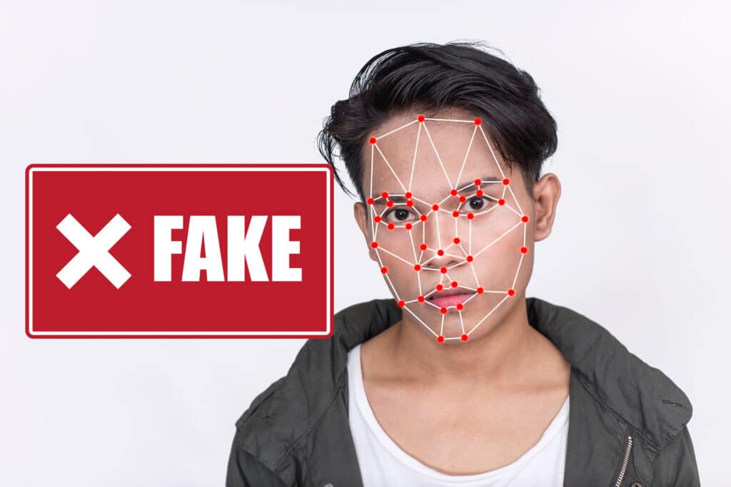A person with facial analysis says fake next to him