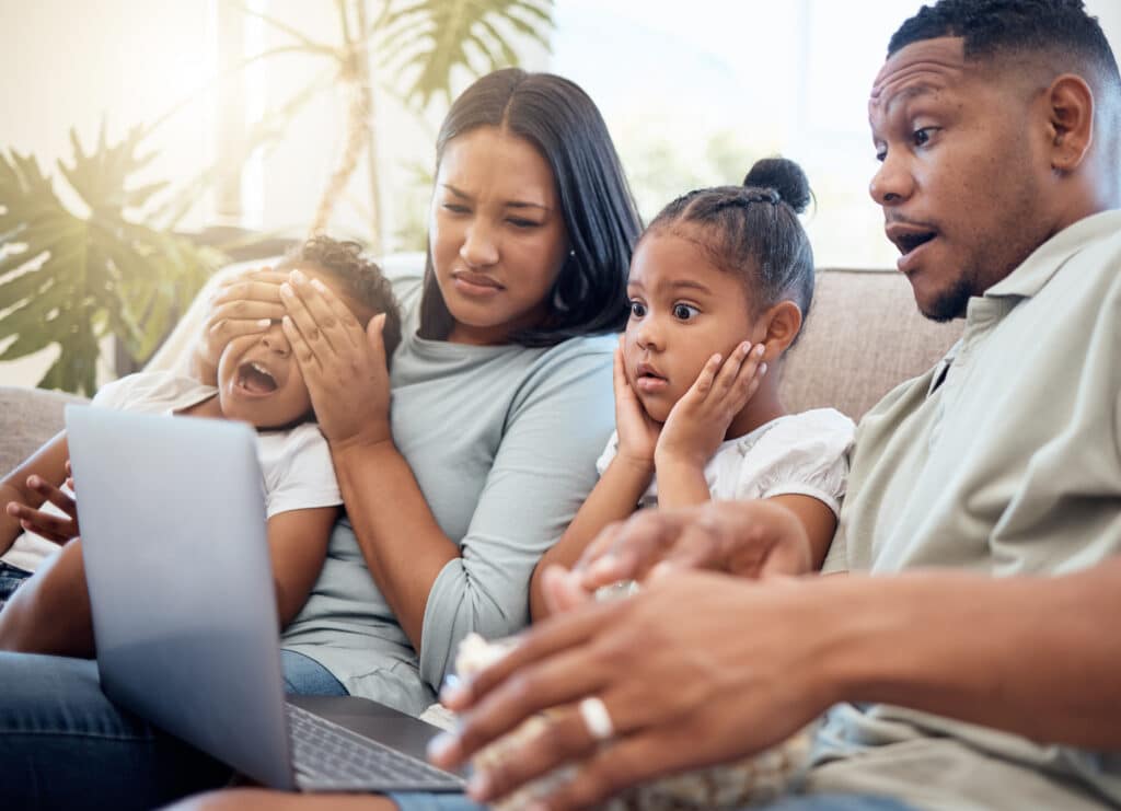 family sees something shocking on a laptop screen