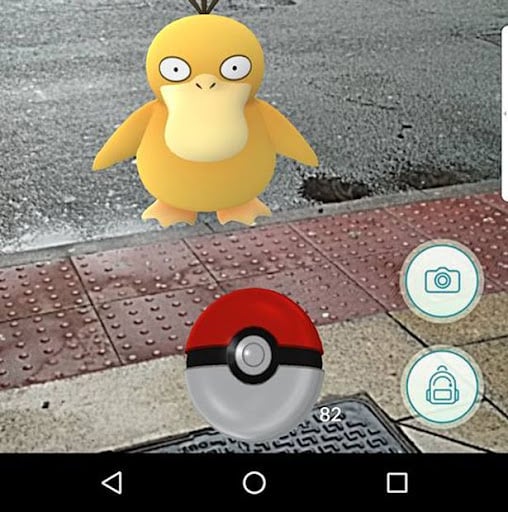psyduck on the street with pokeball