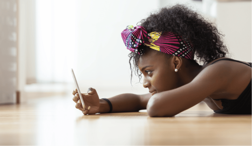 young girl looking at phone